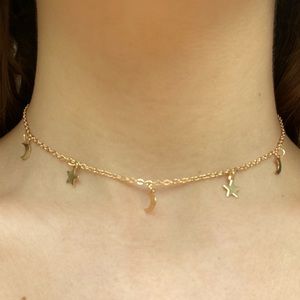 Gold colored star and moon choker necklace